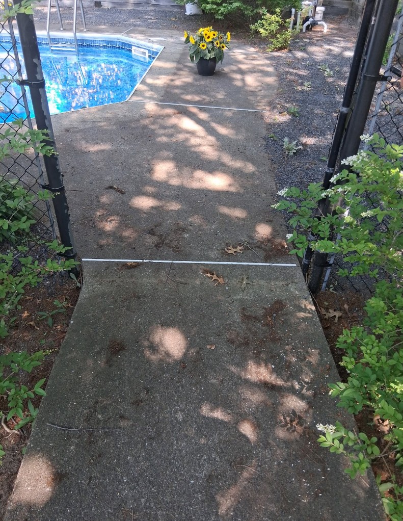 Pool walkway before cleaning